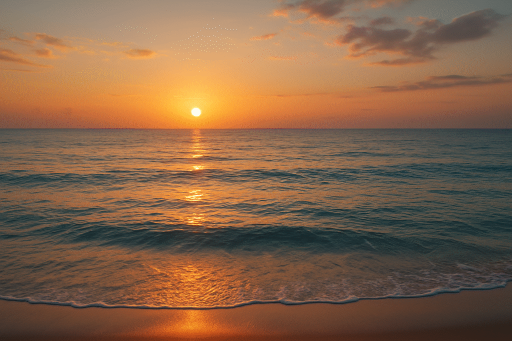 Mar calmo ao pôr do sol representando sonho com tranquilidade no mar.